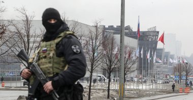 A Russian policeman guards near the burned Crocus City Hall concert venue following a terrorist attack in Krasnogorsk, outside Moscow, Russia, March 23, 2024. (EPA Photo)