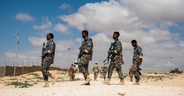 Somali National Army troops wielding practice guns prepare for a drill at the General Dhagabadan Training Center in Mogadishu on March 19, 2024. (AFP File Photo)