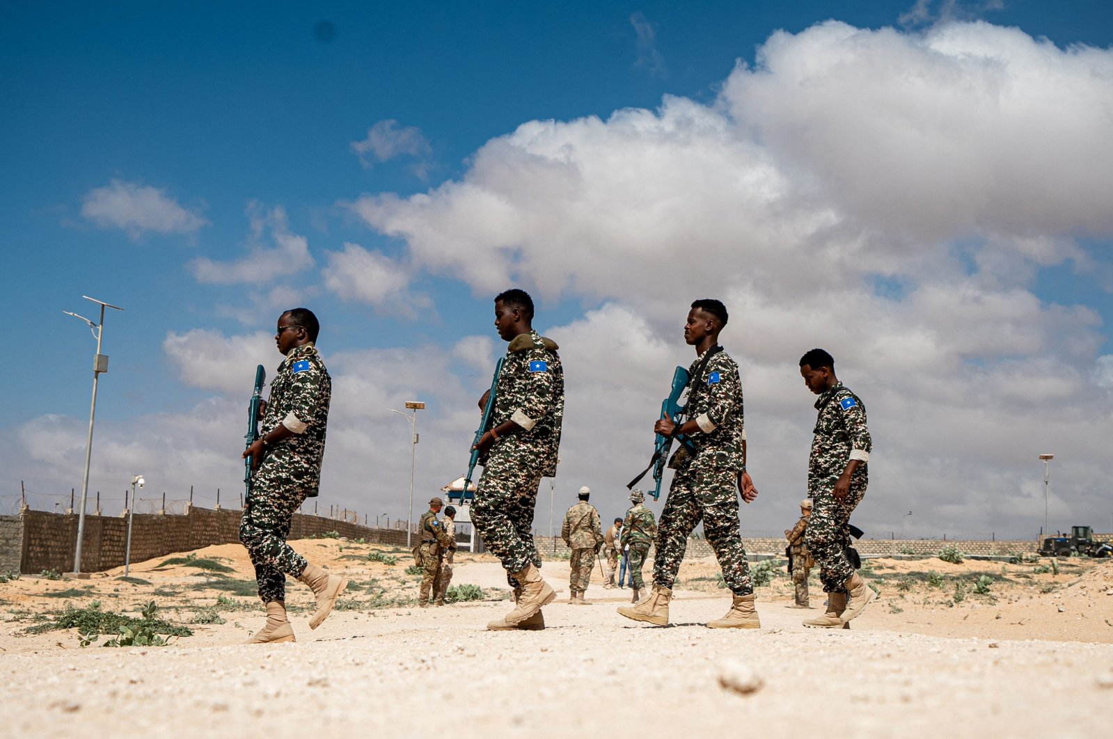 Somali National Army troops wielding practice guns prepare for a drill at the General Dhagabadan Training Center in Mogadishu on March 19, 2024. (AFP File Photo)