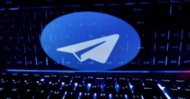 A keyboard is placed in front of a displayed Telegram logo in this illustration taken on Feb. 21, 2023. (Reuters Photo;)