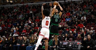 Celtics Jayson Tatum (R) shoots against Bulls' Coby White during an NBA game in Chicago, Illinois, March 23, 2024. (AFP Photo)