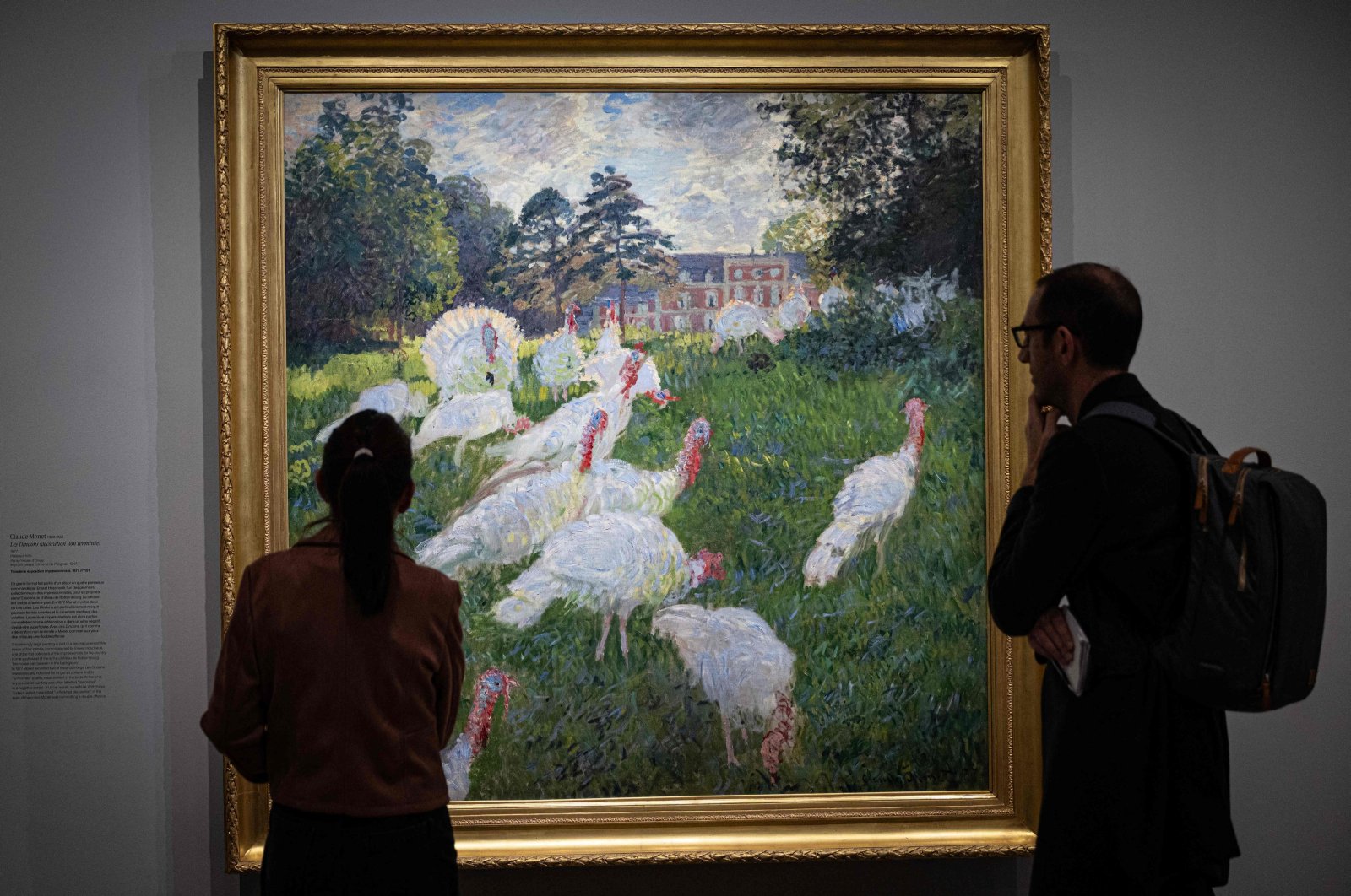 Visitors stand in front of the painting &quot;Les Dindons&quot; (The Turkeys - 1876) by French impressionist painter Claude Monet (1840-1926), Paris, France, March 22, 2024. (AFP Photo)