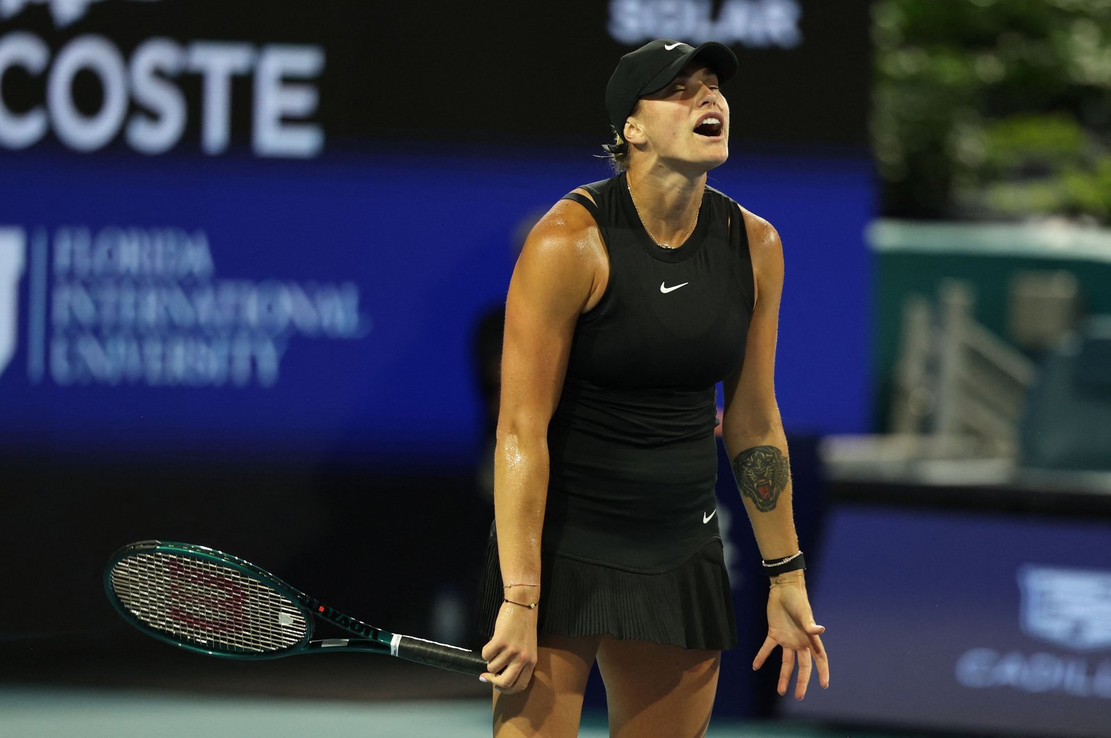 Aryna Sabalenka reacts to a lost point against Anhelina Kalinina during their Miami Open match, Miami Gardens, Florida, March 23, 2024. (AFP Photo)