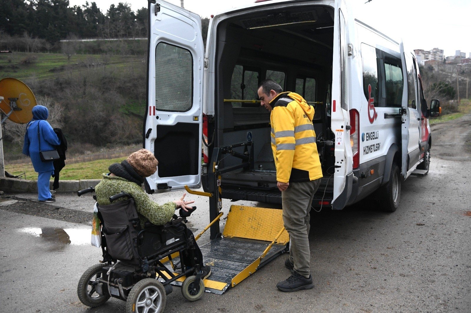 In the scope of the Samsun Municipality&#039;s &#039;Accessible Transportation Vehicle&#039; service, a healthcare worker assists a disabled citizen in boarding the vehicle, Samsun, Türkiye, Feb. 29, 2024. (IHA Photo)
