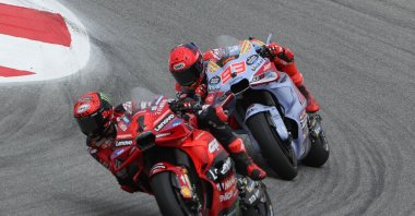 Francesco Bagnaia (L) and Marc Marquez in action during the MotoGP race of the Motorcycling Grand Prix of Portugal, Portimao, Portugal, March 24, 2024. (EPA Photo)
