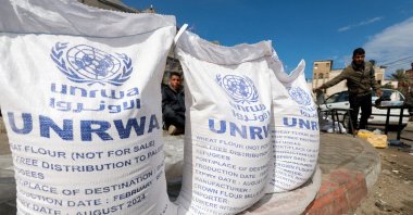 Displaced Palestinians wait to receive UNRWA aid in Rafah, southern Gaza Strip, March 7, 2024. (Reuters Photo)