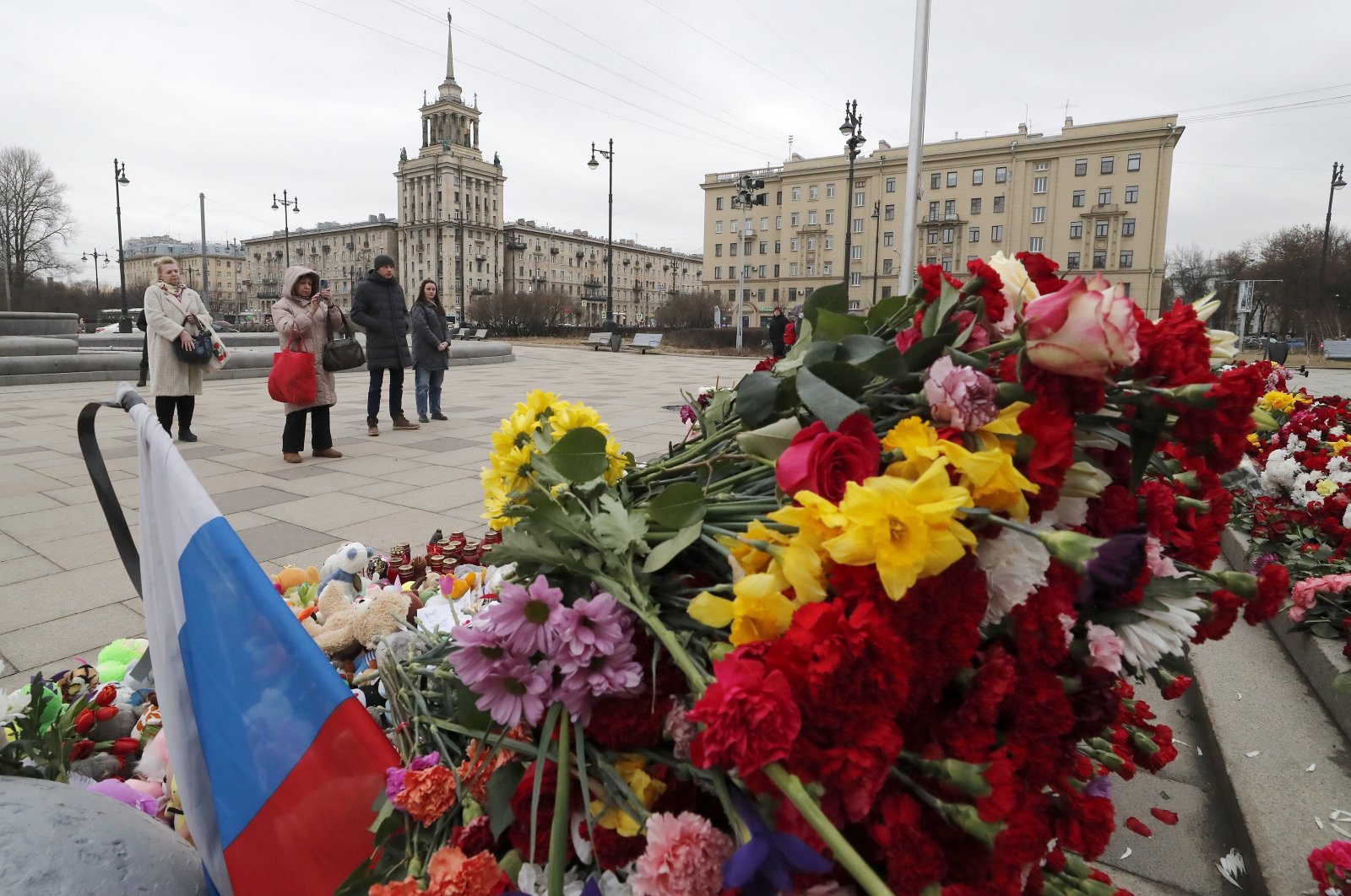 People mourn at a makeshift memorial in front of the Russian National Library in memory of the victims of the terrorist attack at the Crocus City Hall in the Moscow region, in St. Petersburg, Russia, March 25, 2024. (EPA Photo)