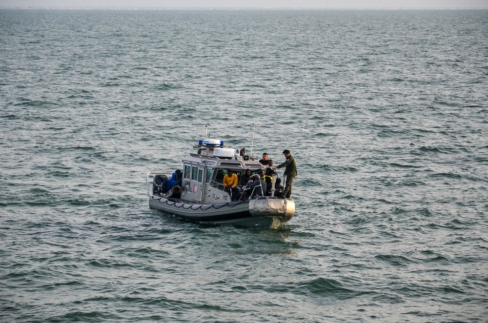 The Tunisian National Guard intercepts migrants trying to cross the Mediterranean Sea before returning the migrants to the shore of the southern city of Sfax, Tunisia, June 9, 2023. (Shutterstock Photo)