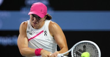 Iga Swiatek in action against Ekaterina Alexandrova during the women&#039;s singles match during the Miami Open at Hard Rock Stadium, Miami, U.S., March 25, 2024. (AFP Photo)