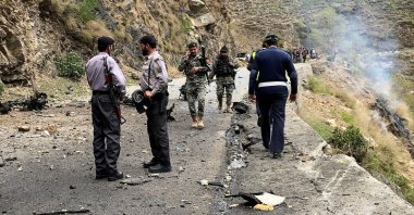 Security personnel inspect the site of a suicide attack near Besham city in the Shangla district, Khyber Pakhtunkhwa province, Pakistan, March 26, 2024. (AFP Photo)