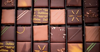 A box of Swiss chocolates is displayed to be sold during the "Festichoc" chocolate festival in Versoix near Geneva, Switzerland, March 16, 2024. (AFP Photo)