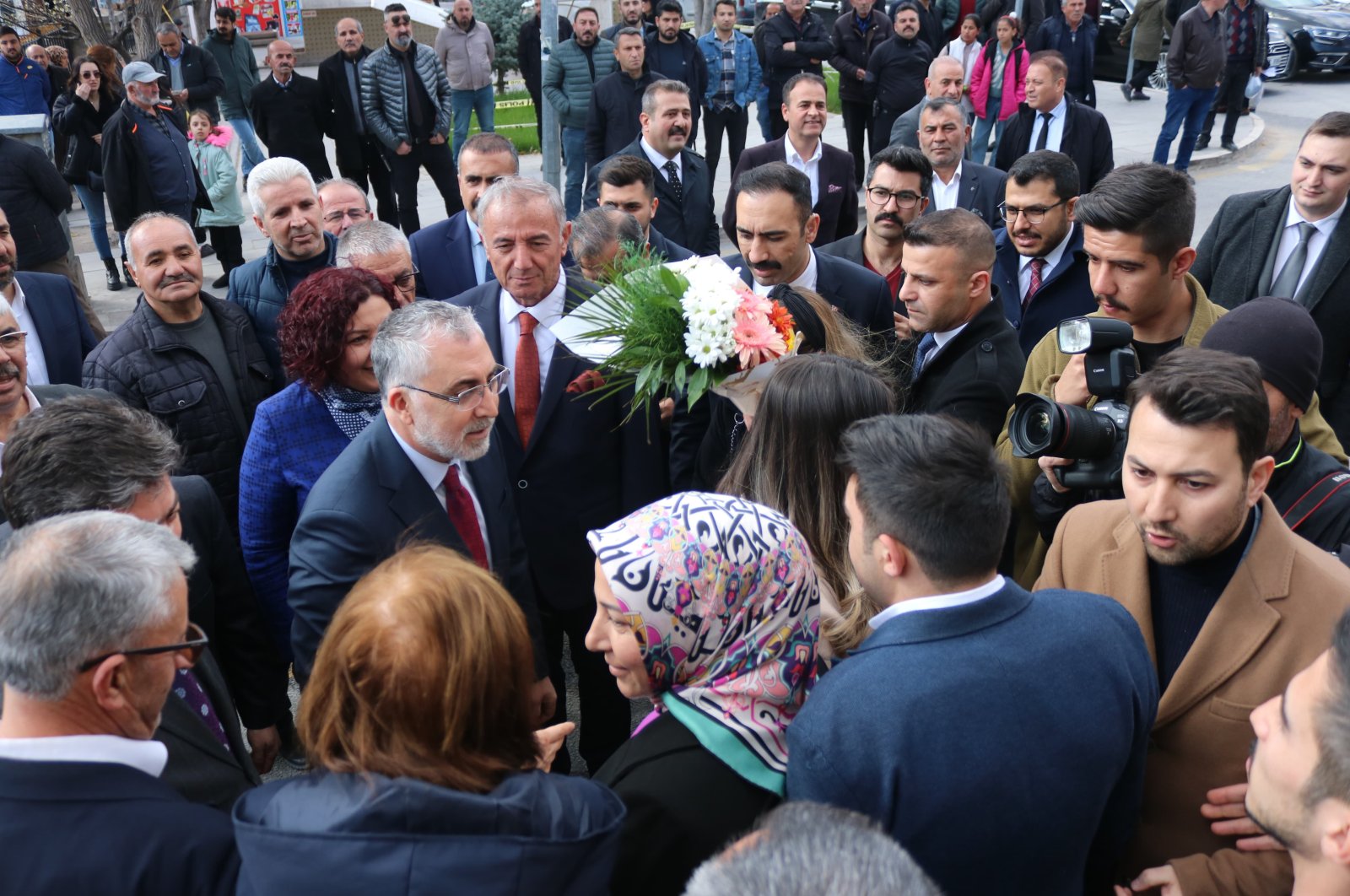 Labor and Social Security Minister Vedat Işıkhan (C-L) speaks to the public during a visit to Kırşehir, central Türkiye, March 25, 2024. (IHA Photo)