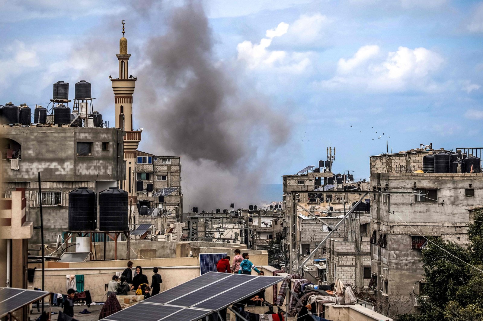 A smoke plume erupts during Israeli bombardment on a building in Rafah in the southern Gaza Strip on March 24, 2024. (AFP Photo)