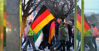 Right-wing protesters carry the national flags of Germany and the ultra-far-right party Freie Sachsen (Free Saxony), Chemnitz, Germany, March 18, 2024. (Reuters Photo)