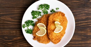 Chicken Schnitzel, German culinary delight, boasts a rich heritage steeped in traditional German cuisine. (Shutterstock Photo) 