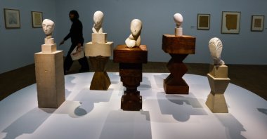 A woman passes artworks by Romanian sculptor Constantin Brancusi, put on display as part of an exhibition on Brancusi at the Centre Pompidou, Paris, France, March 26, 2024. (EPA Photo)
