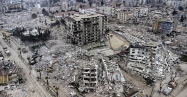 An aerial view shows collapsed buildings after powerful earthquakes in Hatay, southeastern Türkiye, Feb. 21, 2023.