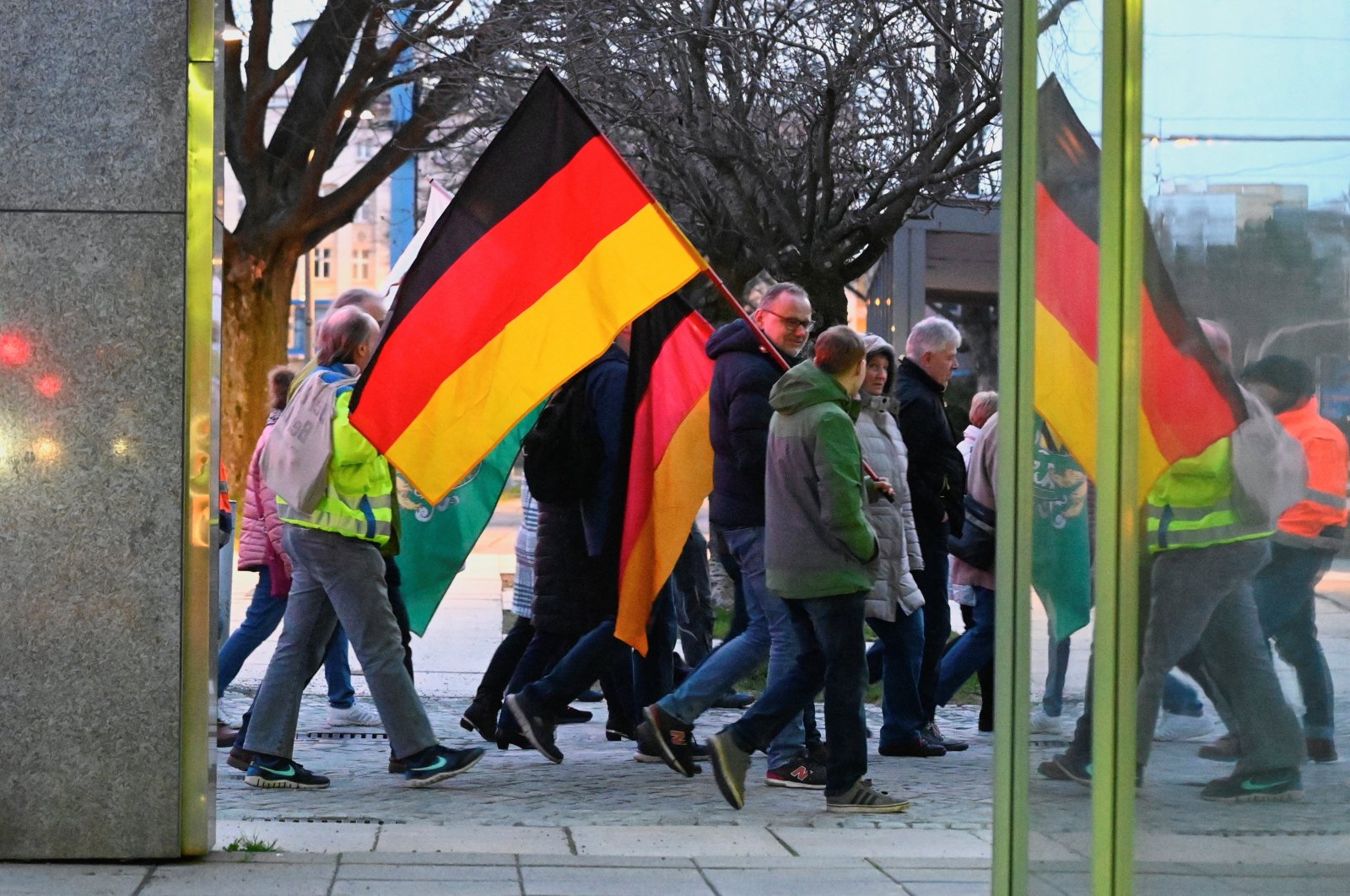 Right-wing protesters carry the national flags of Germany and the ultra-far-right party Freie Sachsen (Free Saxony), Chemnitz, Germany, March 18, 2024. (Reuters Photo)