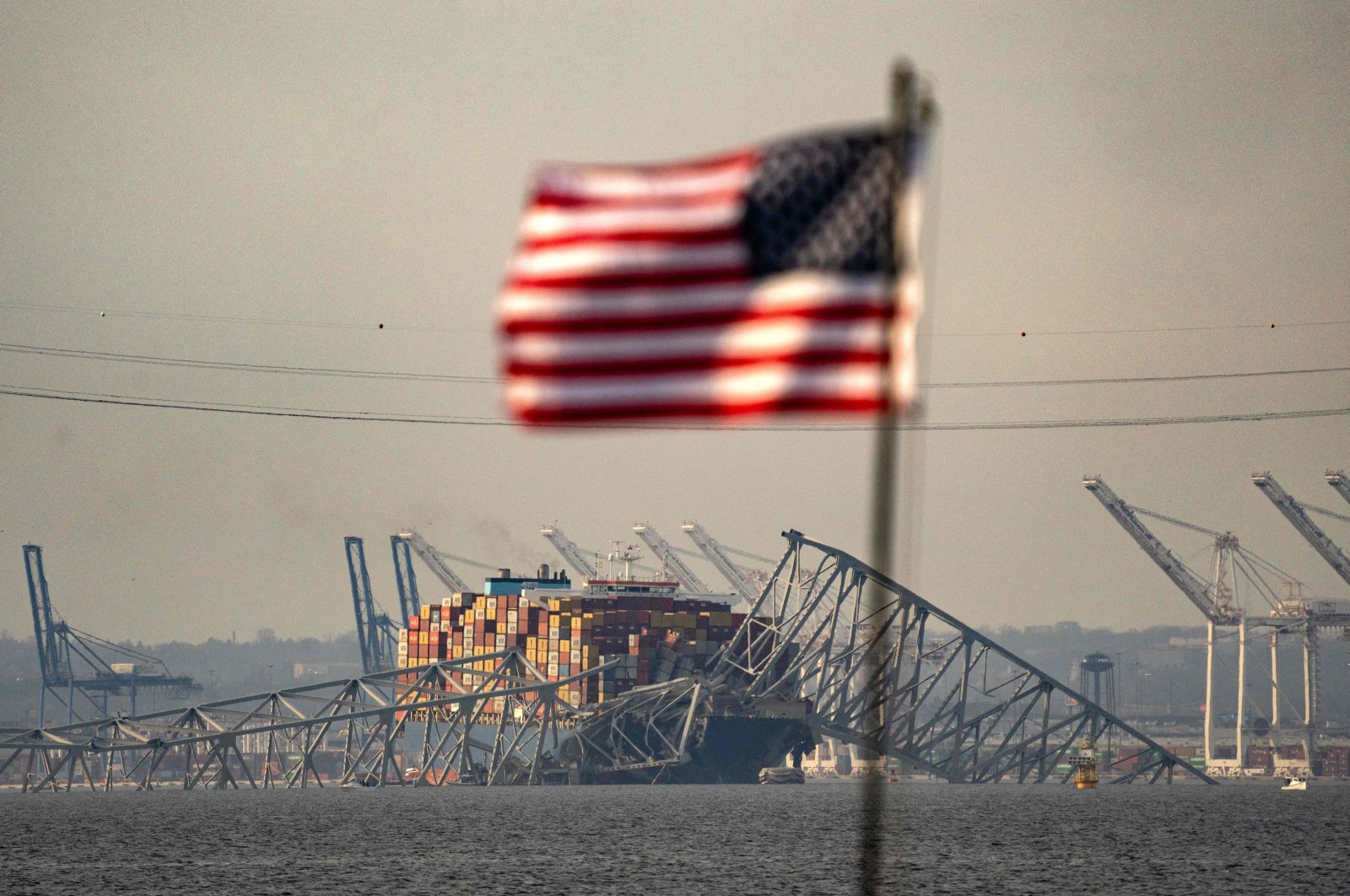 Part of the steel frame of the Francis Scott Key Bridge sits on top of the container ship Dali after the bridge collapsed in Baltimore, Maryland, March 26, 2024. (AFP Photo)