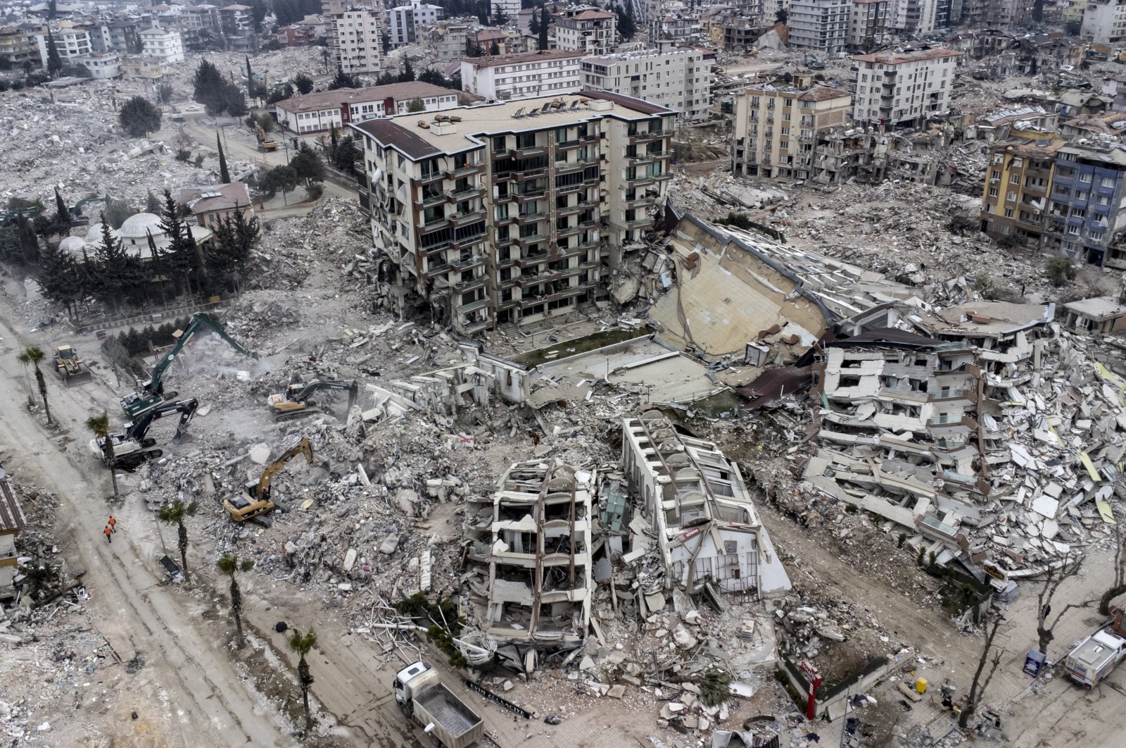 An aerial view shows collapsed buildings after powerful earthquakes in Hatay, southeastern Türkiye, Feb. 21, 2023.