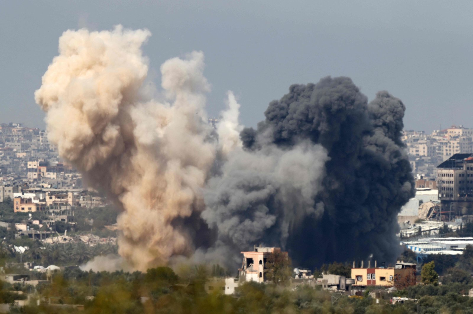 This picture taken from Israel&#039;s southern border with the Gaza Strip shows smoke billowing following an Israeli strike in the besieged Palestinian territory on March 27, 2024. (AFP Photo)
