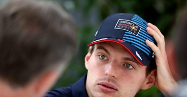 Red Bull Racing&#039;s Dutch driver Max Verstappen (R) talks to Red Bull Racing team principal Christian Horner at the Albert Park Circuit ahead of the Formula One Australian Grand Prix, Melbourne, Australia, March 21, 2024. (AFP Photo)
