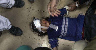 A Palestinian girl wounded in an Israeli attack is treated at the Al-Aqsa Martyrs Hospital in Deir al Balah, Gaza Strip, March 25, 2024. (AP Photo)