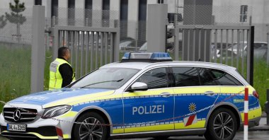 A police car leaves the grounds of Factory 56 at the plant of German car maker Mercedes-Benz in Sindelfingen, southern Germany after shots were fired at the plant on May 11, 2023. (AFP Photo)