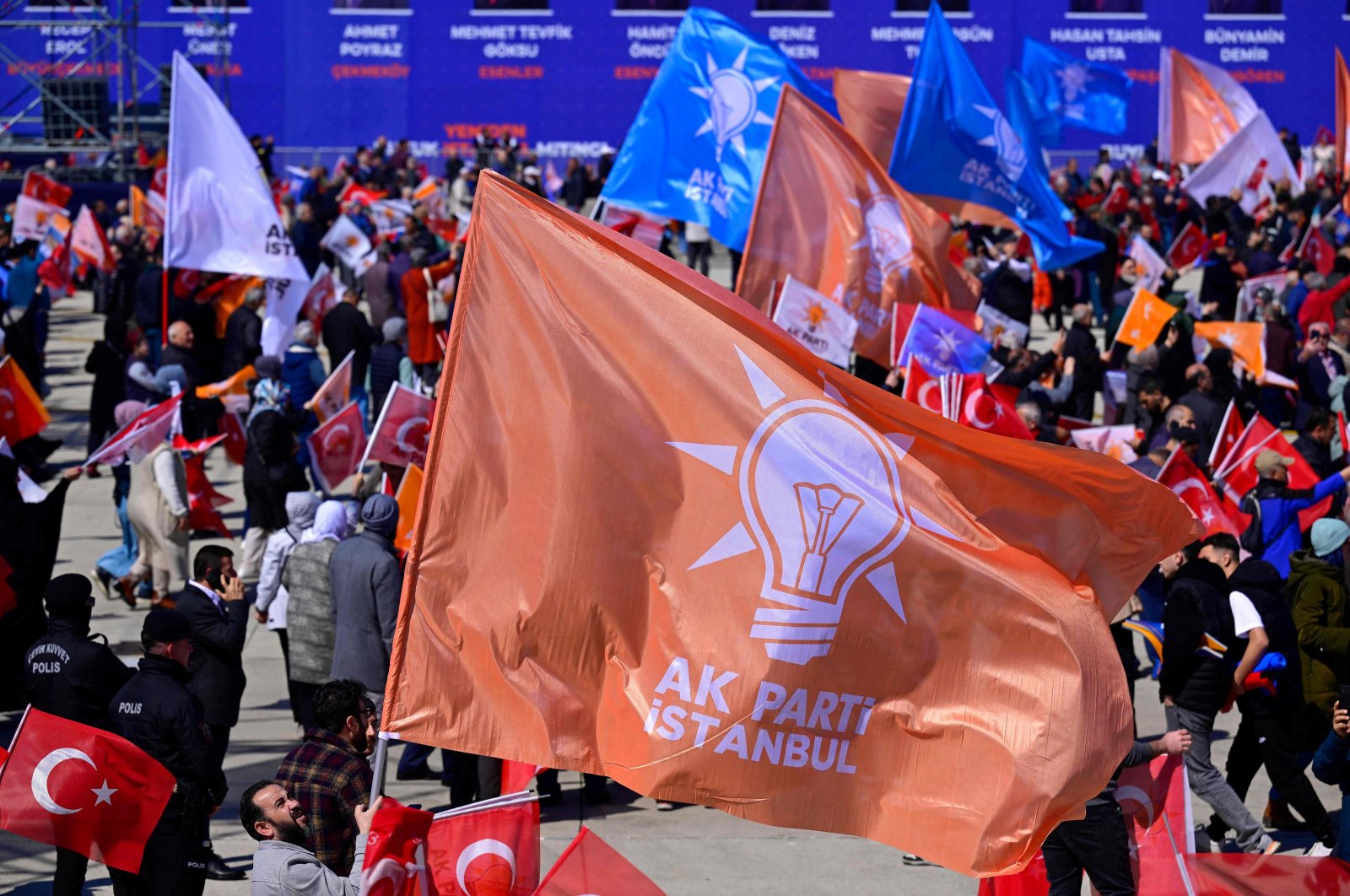 Supporters of the Justice and Development Party (AK Party) hold the party&#039;s flags as they attend an election campaign rally ahead of the March 31 municipal elections, Istanbul, Türkiye, March 24, 2024. (AFP Photo)
