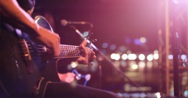 Fingers dancing across frets, the guitar whispers stories of passion and rebellion. (Shutterstock Photo)