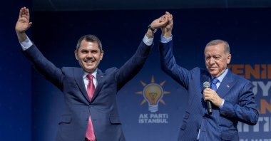 President Recep Tayyip Erdoğan (R) and Murat Kurum, mayoral candidate of the ruling Justice and Development Party (AK Party), greet their supporters during a rally ahead of the local elections in Istanbul, Türkiye, March 24, 2024. (Reuters Photo)