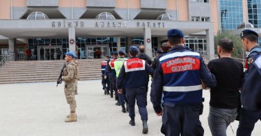 Turkish security forces escort to a courthouse 13 suspected members of FETÖ and PKK caught while trying to flee to Greece, northwestern Edirne province, Türkiye, March 28, 2024. (AA Photo)