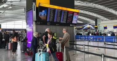 Passengers look at the departures board at Heathrow Airport, London, U.K., Aug. 28, 2023. (AP Photo)