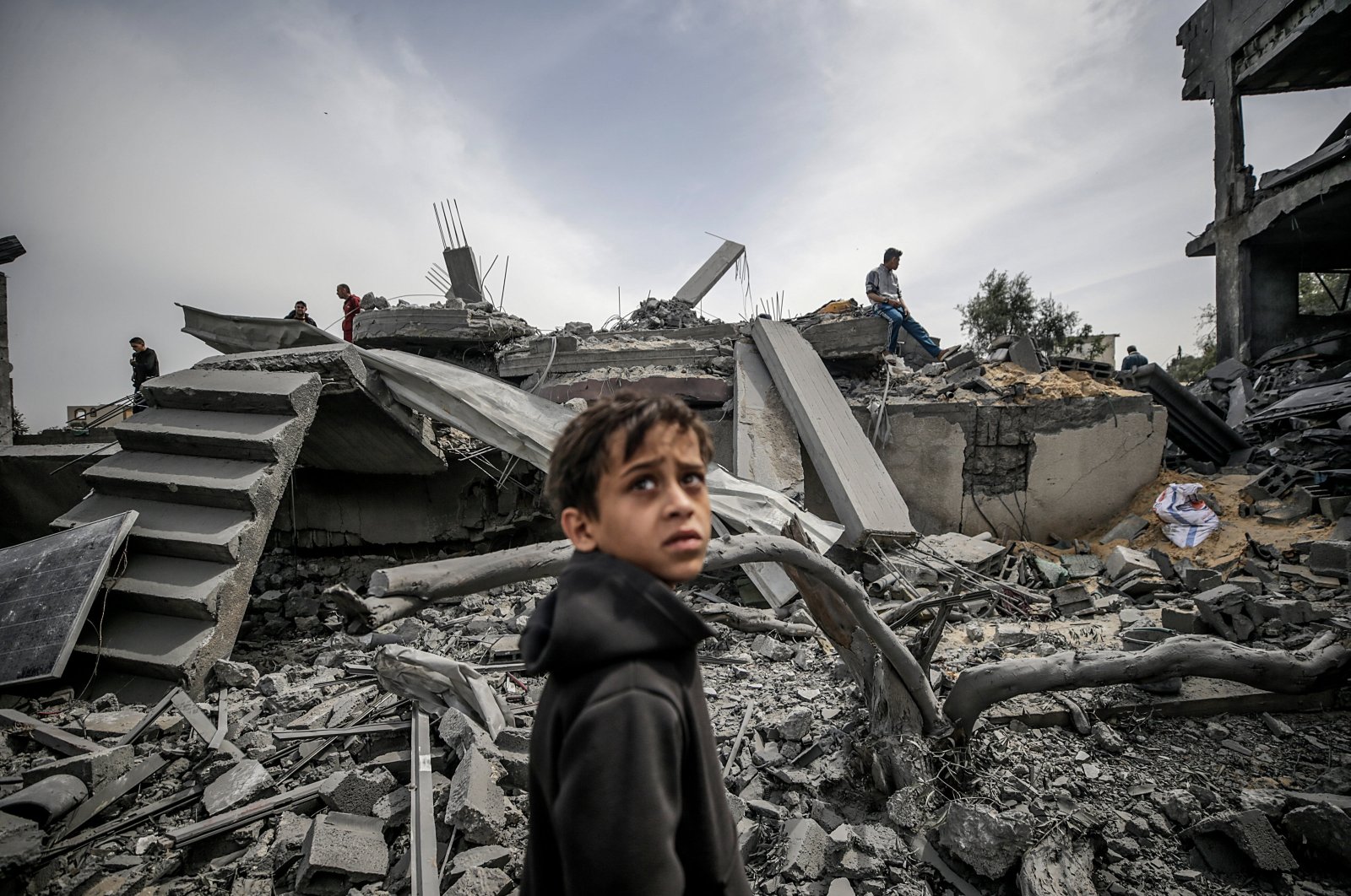 A Palestinian child looks on as the search for missing people continues following an Israeli airstrike, al-Maghazi refugee camp, southern Gaza Strip, Palestine, March 29, 2024. (EPA Photo)