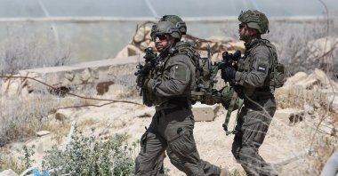Israeli security forces inspect the site of a shooting attack in Al-Awja in the occupied West Bank, Palestine, March 28, 2024. (AFP Photo)
