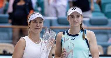 Danielle Collins (L) and Elena Rybakina pose with their trophies after the women's final match of the 2024 Miami Open tennis tournament, Miami, Florida, U.S., March 30, 2024. (EPA Photo)