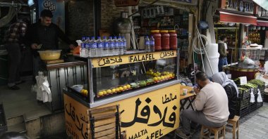 Costumers eat in a Syrian restaurant at the Fatih district of Istanbul, Türkiye, April 29, 2023. (AP Photo)