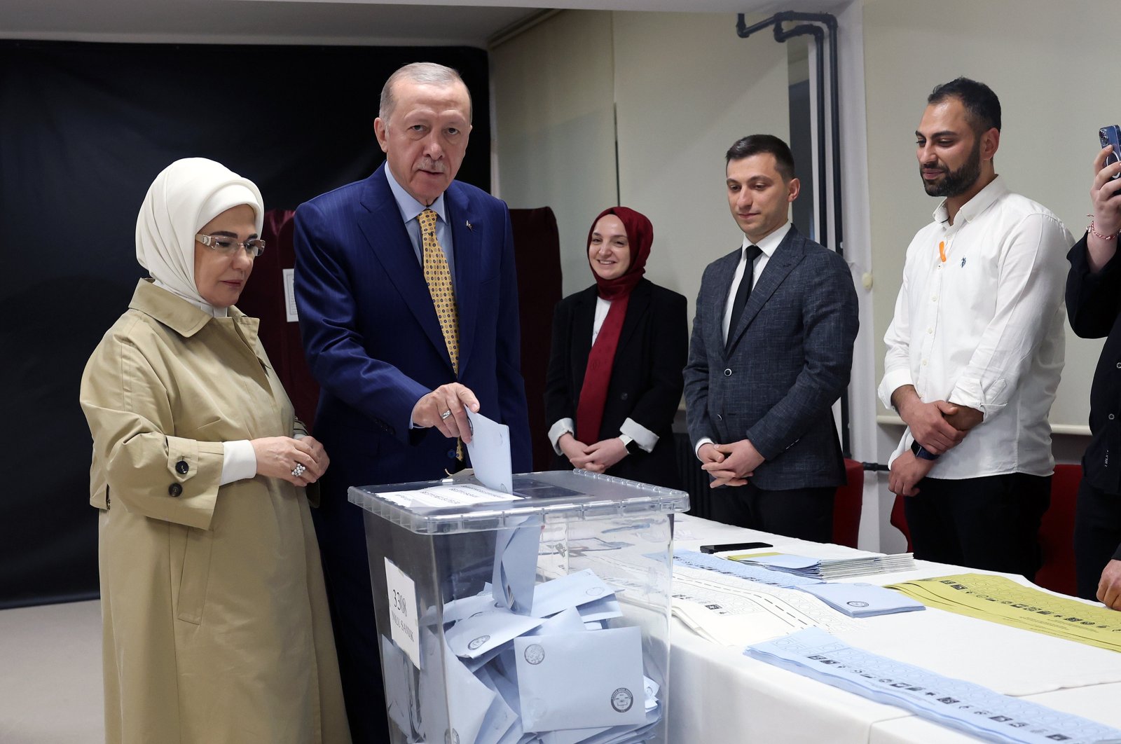 President Recep Tayyip Erdoğan and first lady Emine Erdoğan vote at a polling station during the local elections in Istanbul, Türkiye, March 31, 2024. (EPA Photo)