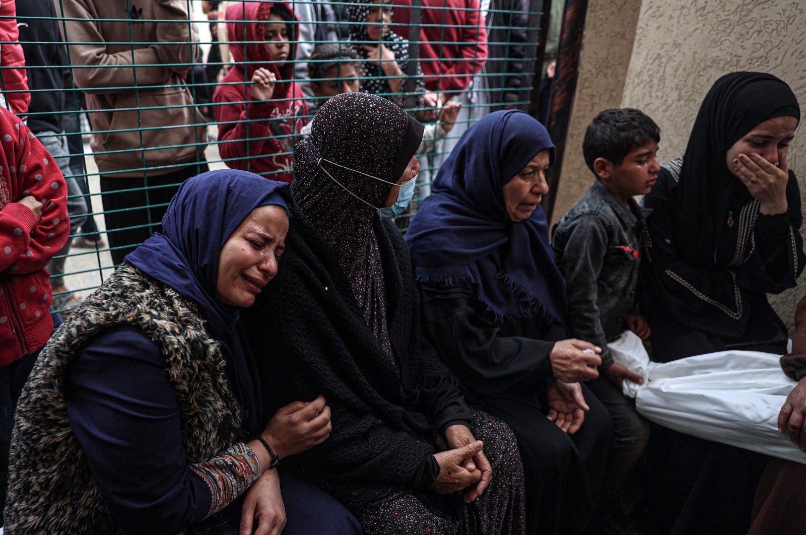 Palestinians mourn over the body of a child killed in Israeli bombardment the night before, the European hospital, Khan Yunis, Gaza Strip, Palestine, March 29, 2024. (AFP Photo)