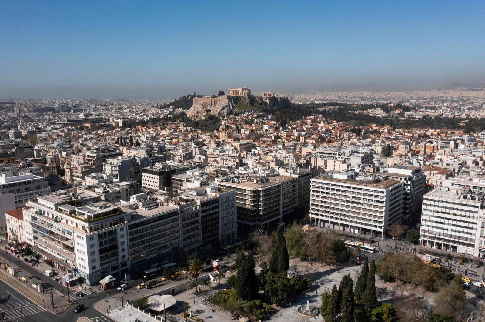The ancient Parthenon temple on the top of Acropolis Hill in the background and residential complexes in front, Athens, Greece, March 30, 2024. (AFP Photo)