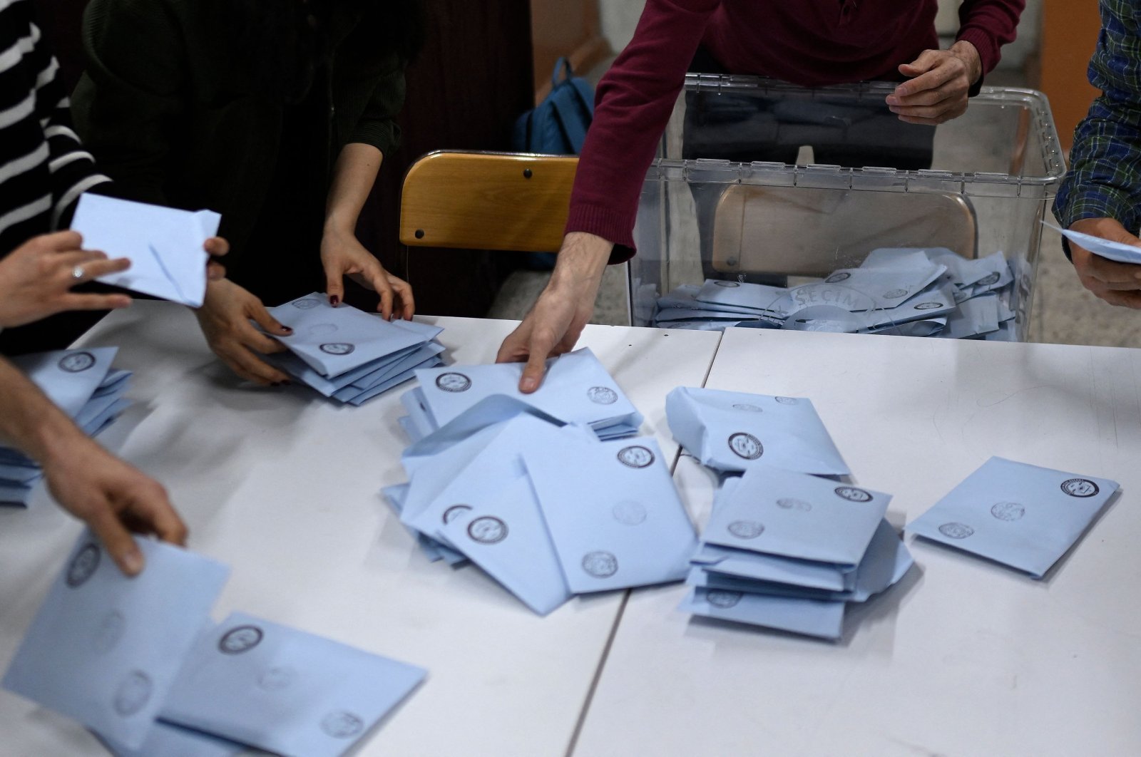 Electoral workers begin to count ballots at a polling station following countrywide municipal elections, Istanbul, Türkiye, March 31, 2024. (AFP Photo)