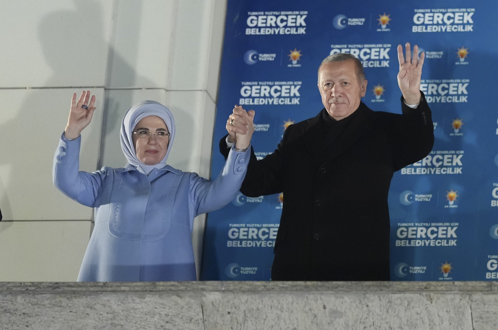 President Recep Tayyip Erdoğan and first lady Emine Erdoğan greet the crowd outside Justice and Development Party (AK Party) headquarters, Ankara, Türkiye, April 1, 2024. (AA Photo)