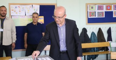 Treasury and Finance Minister Mehmet Şimşek casts his ballot for the municipal elections in Ankara, Türkiye, March 31, 2024. (AA Photo)