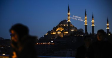 Lights message installed in between the minarets of the Suleymaniye mosque reads in Turkish "Ramadan is the month of Quran" ahead of the Muslim holy month of Ramadan in Istanbul, Türkiye, March 10, 2024. (AP Photo)