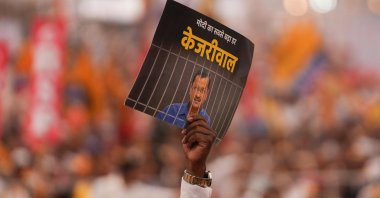 Supporters of India&#039;s opposition coalition displays a placard with a message on Delhi Chief Minister Arvind Kejriwal, New Delhi, India, March 31, 2024. (AFP Photo)