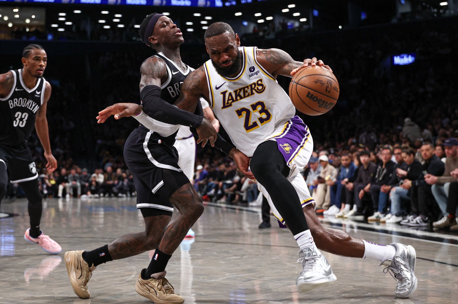 Los Angeles Lakers&#039; LeBron James (R) dribbles against Brooklyn Nets&#039; Dennis Schroder during the second half at Barclays Center, Brooklyn, New York, U.S., March 31, 2024. (Reuters Photo)
