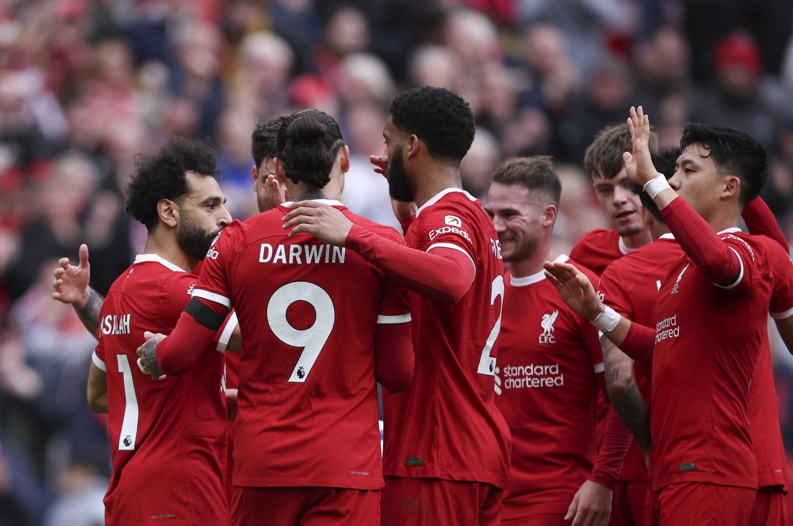 Mohamed Salah (L) celebrates with Liverpool teammates after scoring the 2-1 lead during the English Premier League match against Brighton &amp; Hove Albion, Liverpool, U.K., March 31, 2024.  (EPA Photo)