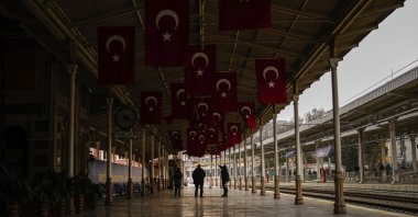 People walk along Sirkeci railway station, Istanbul, Türkiye, March 20, 2024. (AP Photo)