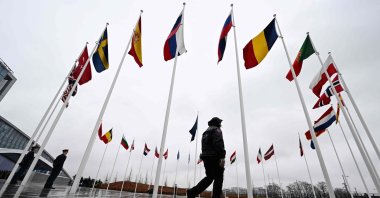 Flags of NATO member countries flutter on poles outside the bloc's headquarters, Brussels, Belgium, March 11, 2024. (AFP Photo)