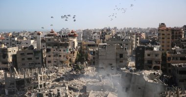 Humanitarian aid is dropped over the Gaza Strip as seen from Al-Shifa hospital after the Israeli military withdrew from the complex housing the hospital on April 1, 2024. (AFP Photo)